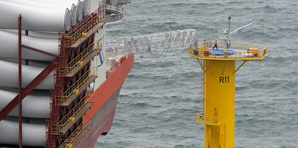 A technician goes over the foundation for a wind turbine at the nearly completed Riffgat offshore wind farm in the North Sea.