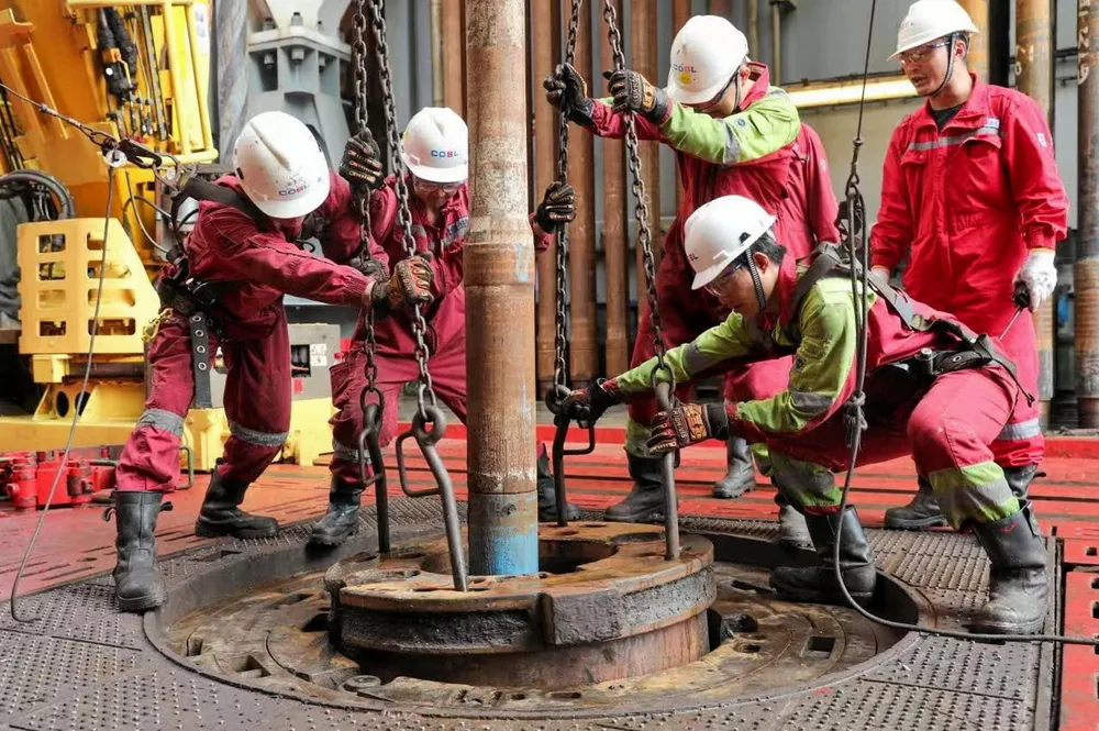 Workers at a CNOOC Ltd drilling operation. The company has finished a drilling campaign at the Lingshui 25-1 gas field in the South China Sea.