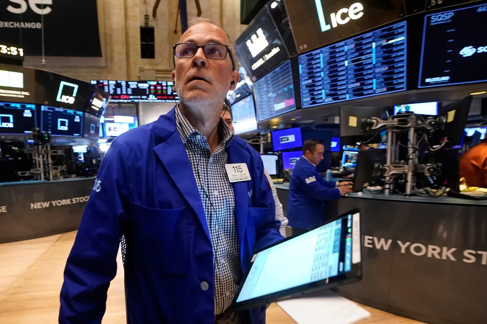 A trader on the floor of the New York Stock Exchange on Tuesday, 6 August 2024.