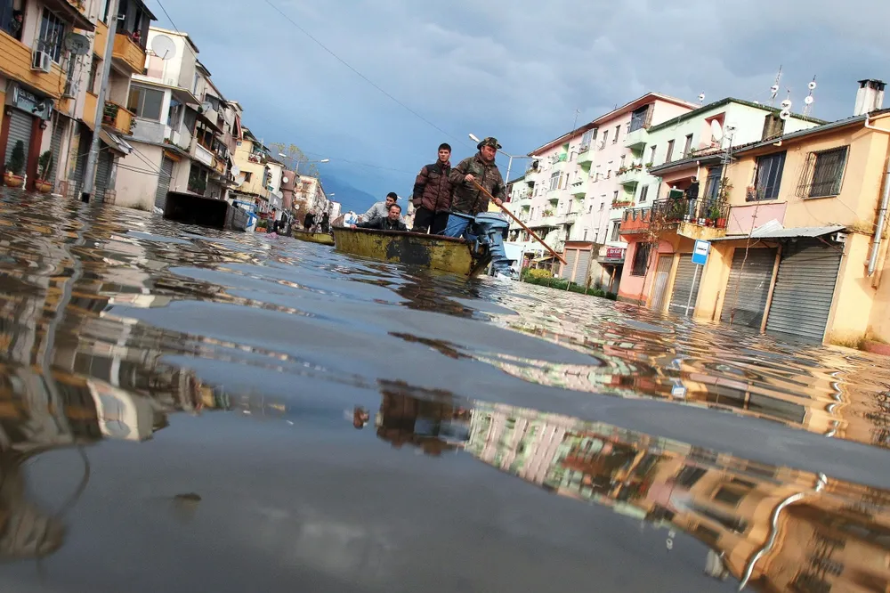 Awash: civil defence workers patrol the city of Shkoder by boat after northern Albania by hit by floods