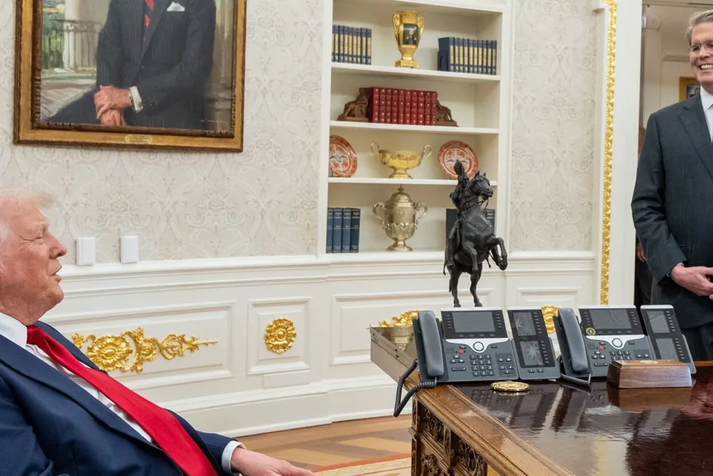 President Donald Trump (left) speaks to treasury secretary Scott Bessent in the White House.