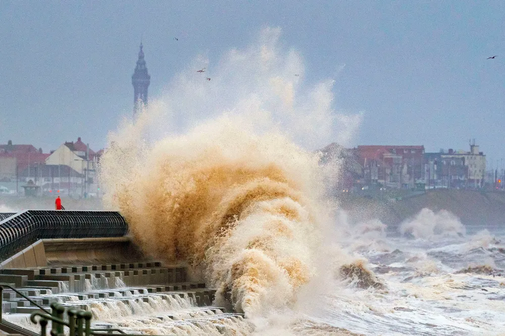 Storms: waves crash on the seafront at Blackpool before on Wednesday