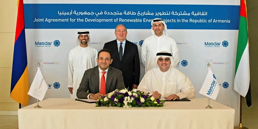 Executives of Masdar and the Armenian National Interests Fund signing the agreement