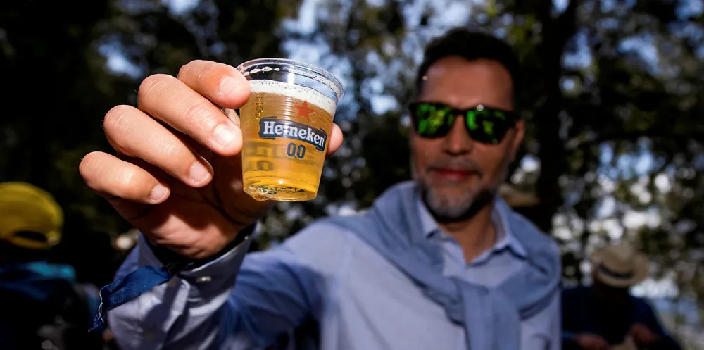 Guests enjoy the atmosphere at the Heineken 0.0 grandstand, celebrating the launch of the zero alcohol beer 'Heineken 0.0' during the Spanish Formula One Grand Prix.