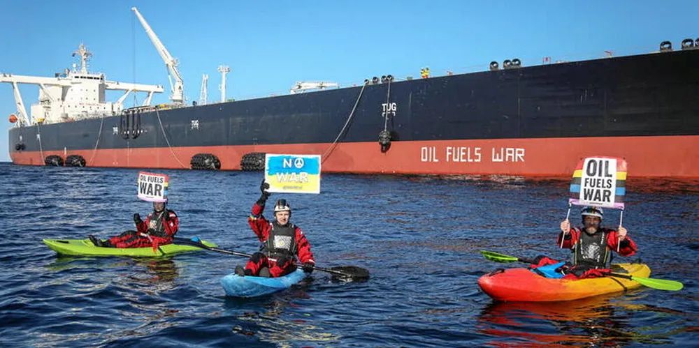 Greenpeace activists blockade a transshipment of Russian oil off northern Denmark.