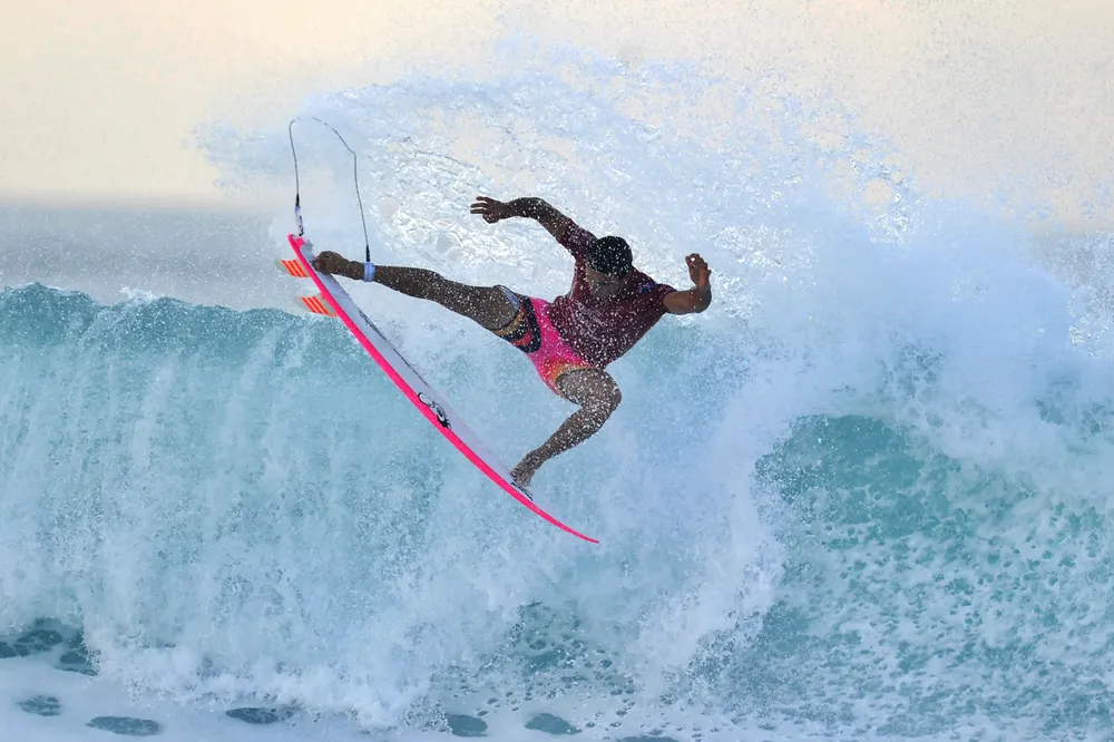 Crest of a wave: riding the surf at a men's championship in Gianyar, Indonesia.