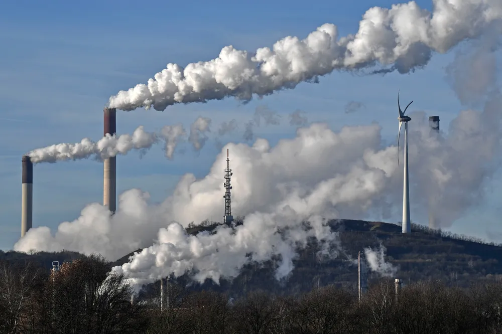 Generations: A coal-fired power plant, a refinery and a wind turbine operate within sight of each other Gelsenkirchen, Germany