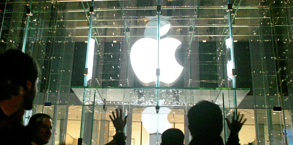 Visitors wait in line to enter the new Apple Store on New York City in 2006 in New York City