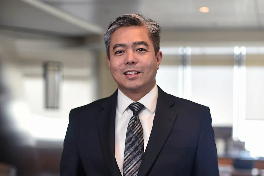 Adif Zulkilfi (pictured) hands over the top upstream job at Petronas to Jukris Abdul Wahab.