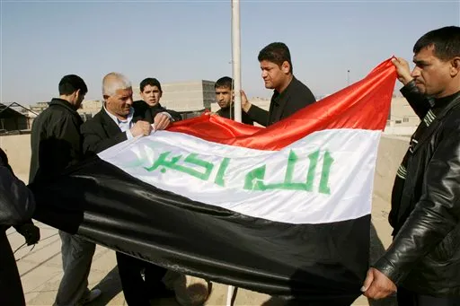 Sadr City's council officials prepare to hoist the new Iraqi flag in Baghdad, Iraq, Tuesday, Feb. 5, 2008. Earlier this month, Iraq's parliament voted to remove Saddam-era emblems from the banner, including the stars thought to represent the three objectives of Saddam's now-dissolved party: unity, freedom and socialism. The new Arabic script across the middle of the flag reads 'God is Great'.(AP Photo/Karim Kadim)