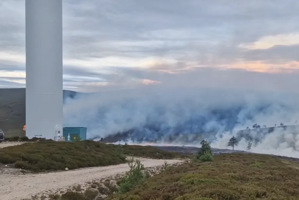Video posted by local firefighters shows flames near the base of a Siemens turbine at the wind farm in Scotland.