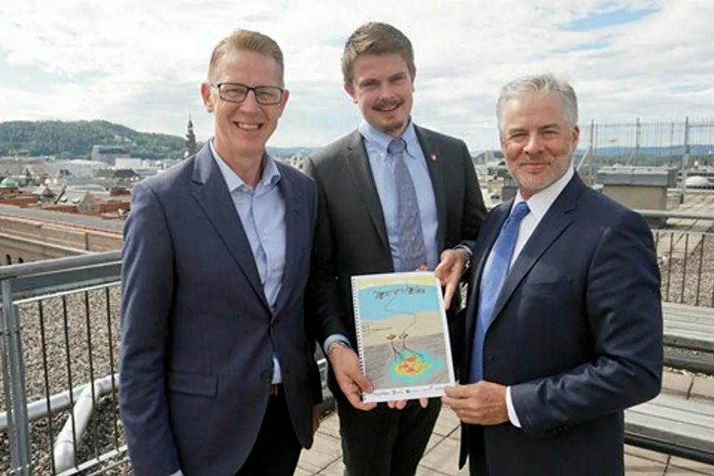 Handover: the ministry's state secretary Rikard Gaarder Knutsen (far right) receives Tor 2 plan from ConocoPhillips' operations director Jan-Arne Johansen (left) and regional director for Norway and Africa Trond Erik Johansen
