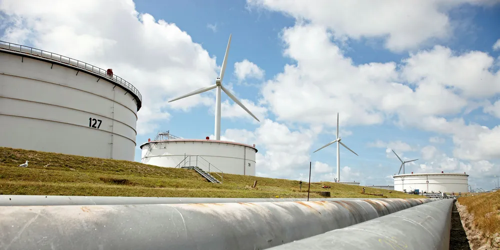 Wind turbines and storage tanks at BP’s refinery in Rotterdam, the Netherlands