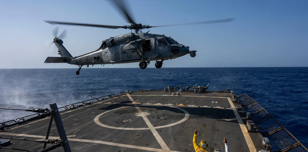 An HSC-7 helicopter lands on the Arleigh Burke-class guided-missile destroyer USS Laboon in the Red Sea on Wednesday.