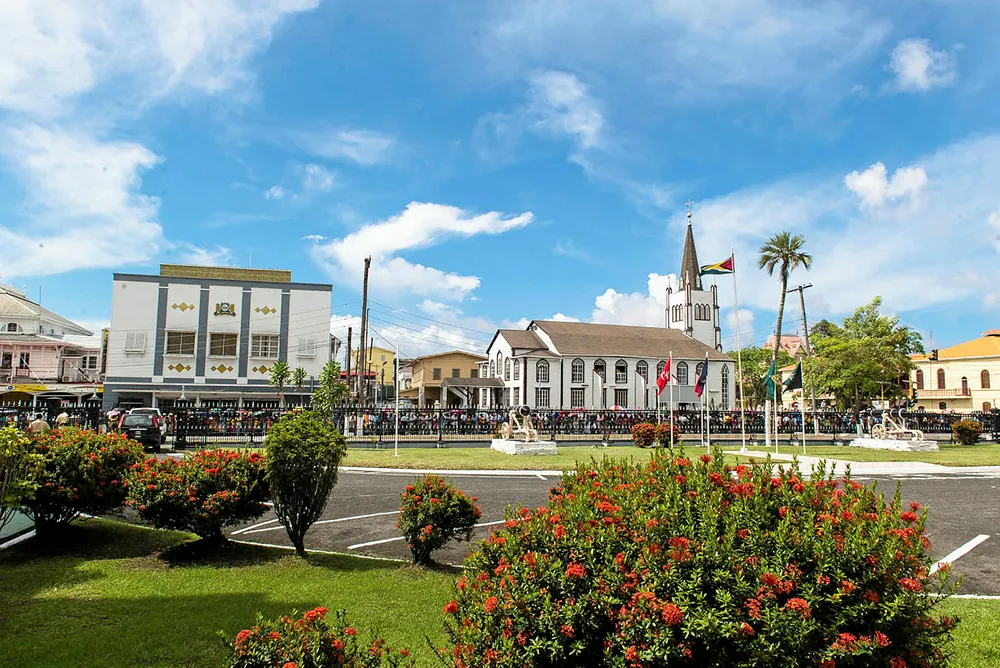 Election date to be decided: members of the public outside the parliament building in Georgetown, Guyana