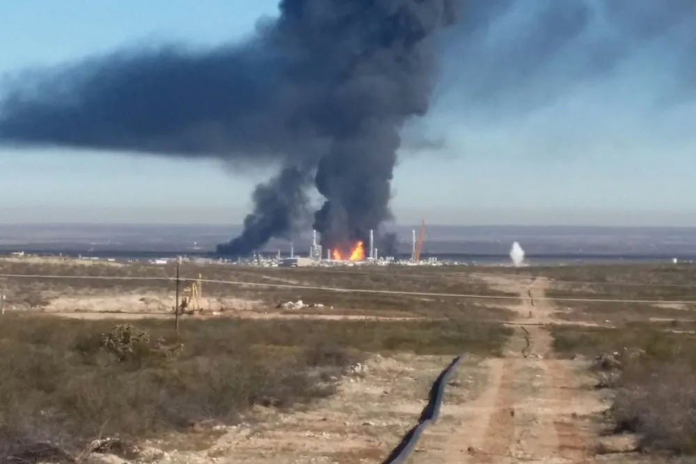 Explosion: A plume of black smoke rises from the Ramsey plant following the blast
