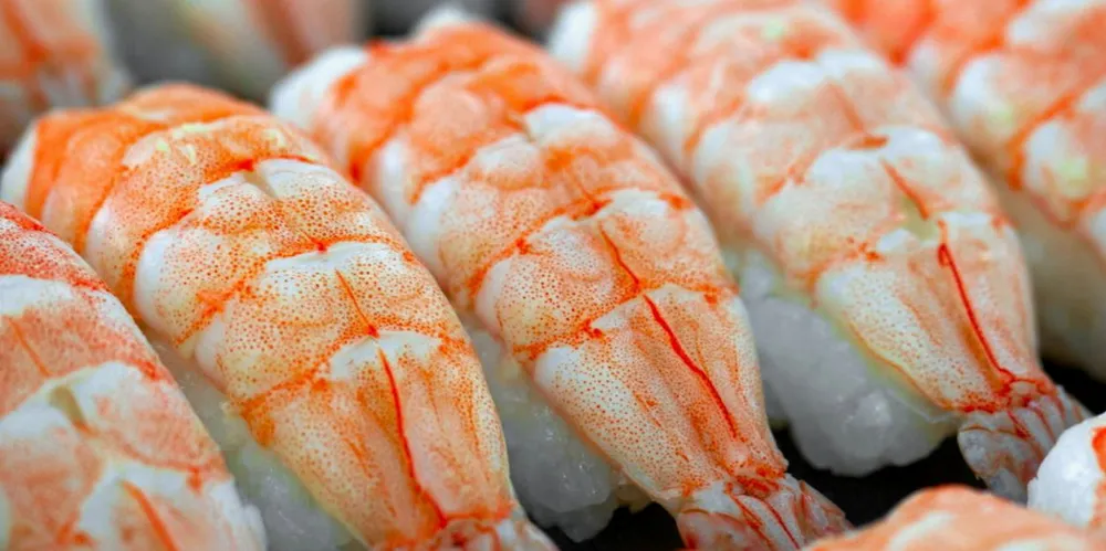 As shrimp are made to grow faster in more intensive, higher density farming systems, pigmentation is fading.