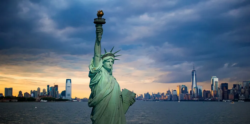 The Statue of Liberty with a view of both New York and New Jersey.
