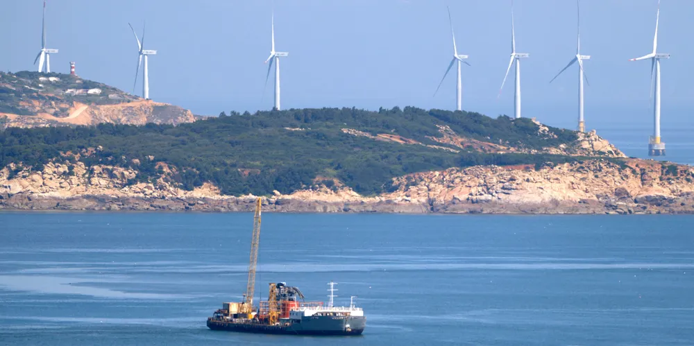 Wind turbines line the coastline of Pingtan in southern China’s Fujian province.