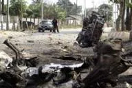 Blast site: the remains of a vehicle used in a car bomb attack on state government offices lie in a street in the Nigerian city of Port Harcourt