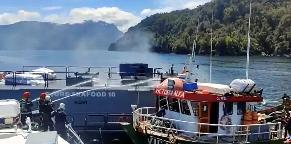 Screenshot from video of Chilean Navy shows the feeding barge fire being put out.
