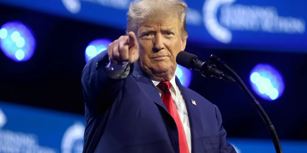 Donald Trump speaking with attendees at the 2023 Turning Point Action Conference at the Palm Beach County Convention Center in West Palm Beach, Florida.