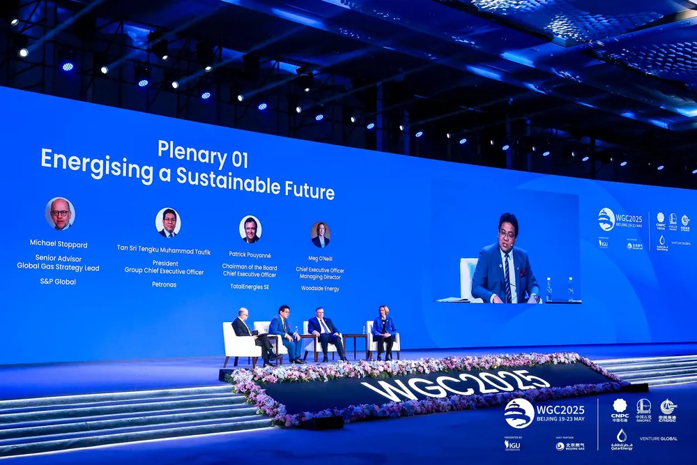 TotalEnergies chief executive Patrick Pouyanne, Petronas chief executive Tengku Muhammad Taufik and Woodside Energy chief executive Meg O'Neill speak at WGC 2025