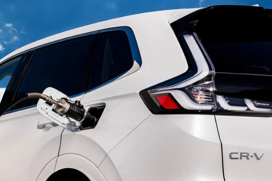 A promotional image of a Honda fuel-cell CR-V being refuelled