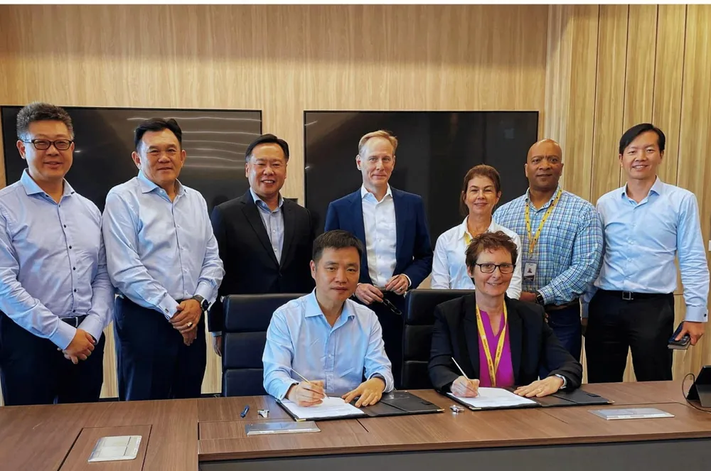 Signing: Shell and Seatrium officials sign the MoU