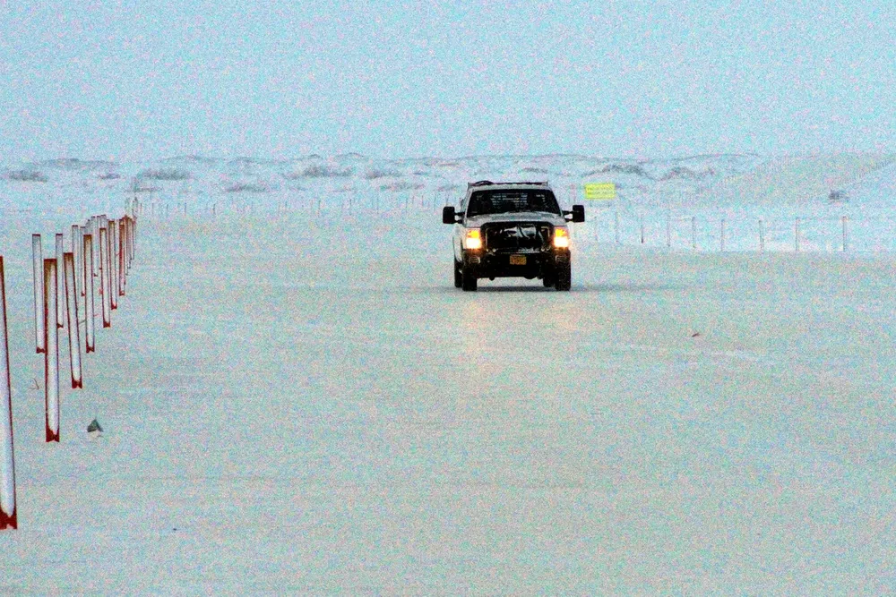 Cold call: a truck driving on an ice bridge in Alaska's North Slope