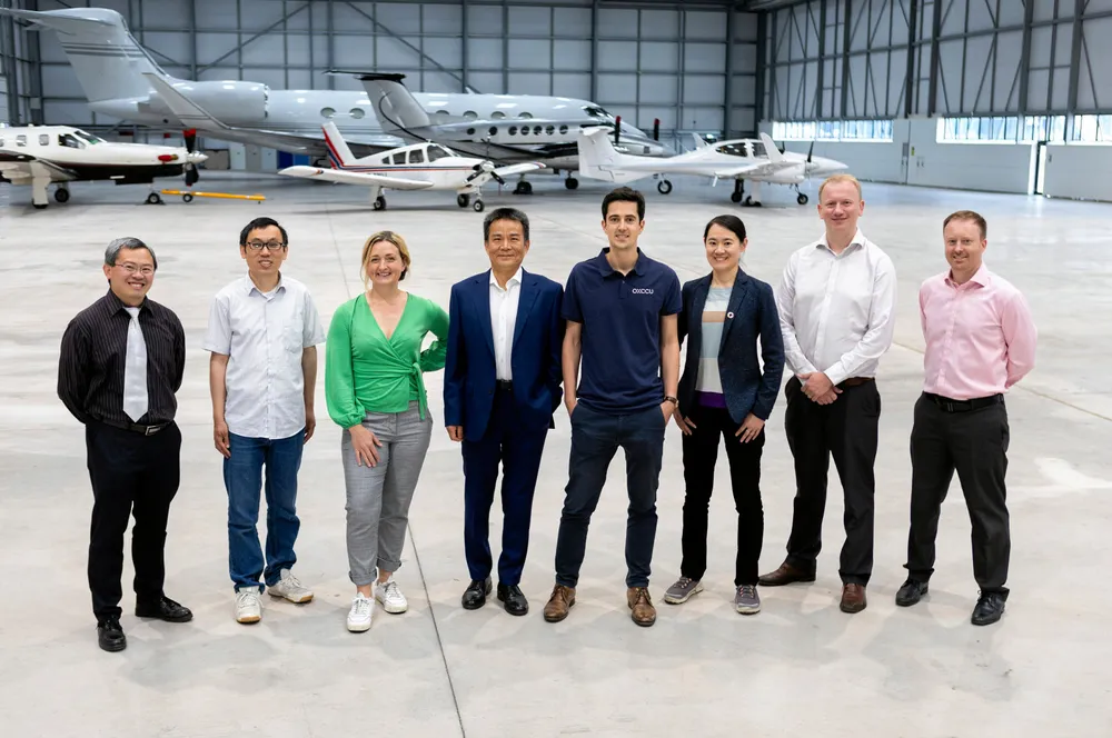 OXCCU's leadership team, including CEO Andrew Symes (in blue polo shirt).