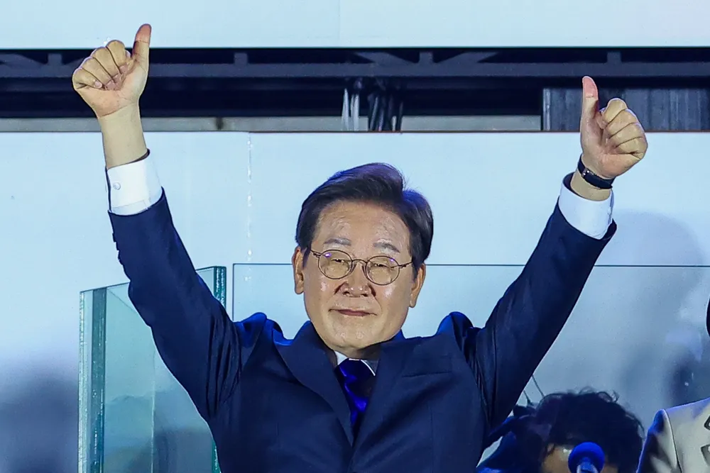 Democratic Party's presidential candidate Lee Jae-myung gestures as he attends a celebration party to announce his victory in the election.