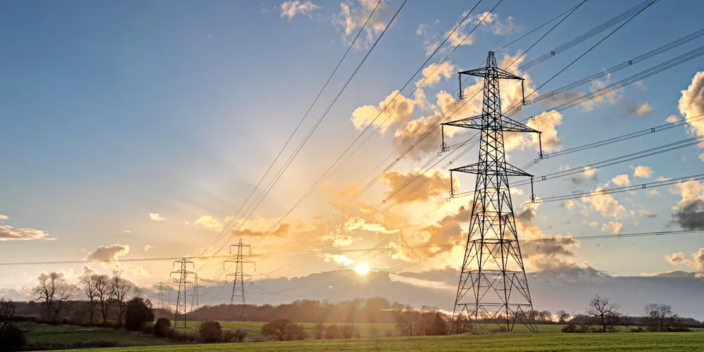 Electricity Pylon - UK standard overhead power line transmission tower at sunset.; Shutterstock ID 185467274; Purchase Order: 1070; Job: Rejlers Reljers. Reljers.