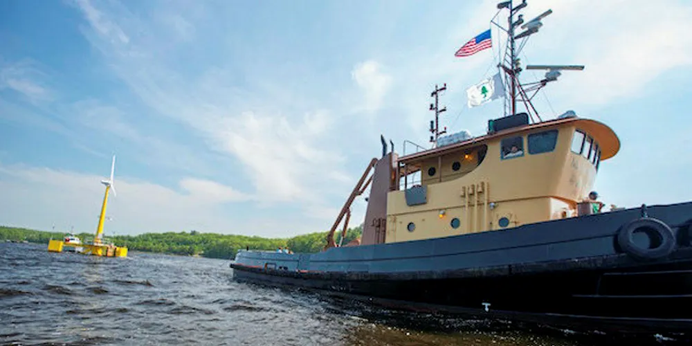 A 1:8 scale prototype of UMaine's floating turbine being towed to sea earlier this decade