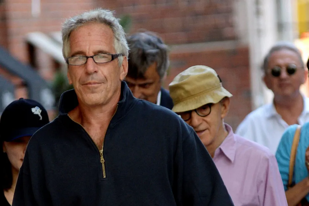 Jeffrey Epstein looks straight into the camera while walking with Woody Allen and his wife Soon Yi-Previn, who you can glimpse just behind him. The men in the back are Norwegians Håkon Gundersen and Terje Rød-Larsen. The latter is out of focus and to the far right. (Photograph: Elder Ordonez/SplashNews.com)