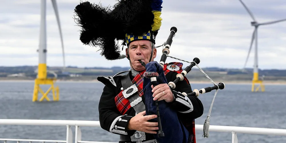 A piper performing at the opening of the the European Offshore Wind Deployment Centre in Aberdeen Bay.
