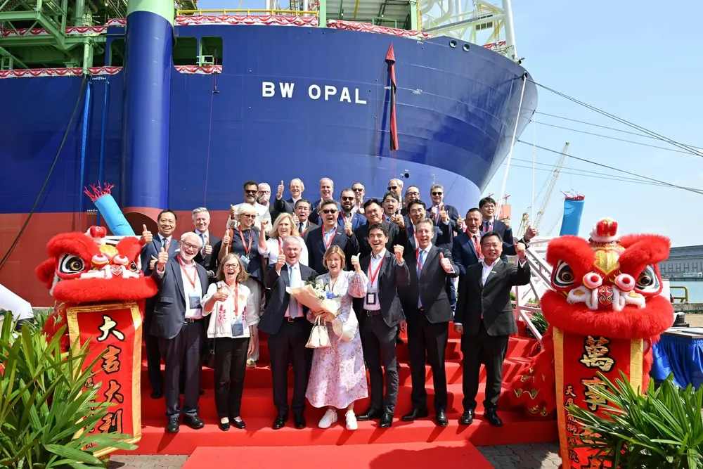 Santos' latest gas asset - the FPSO BW Opal for the Barossa field - with chief executive, Kevin Gallagher, (front row third left) and chairman, Keith Spence, (front row far left).
