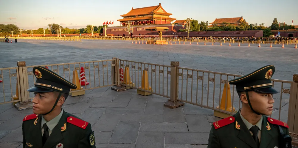People’s Liberation Army soldiers stand guard in Tiananmen Square.