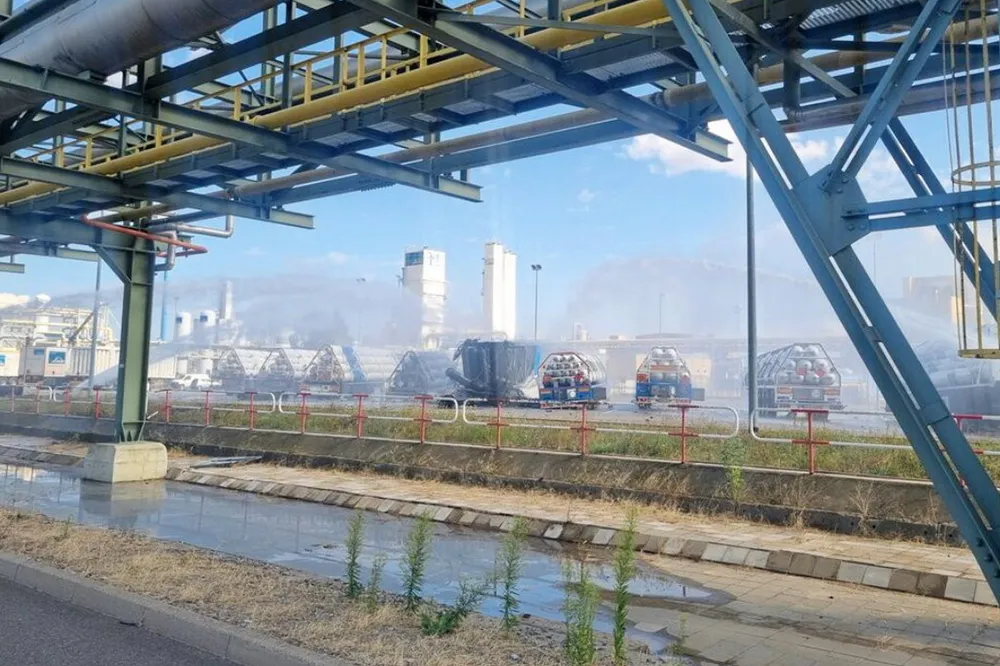 The charred truck trailer and hydrogen cylinders damaged in the explosion being doused with water by Leuna Chemical Park's own firefighters on 26 August. No-one was injured in the accident.