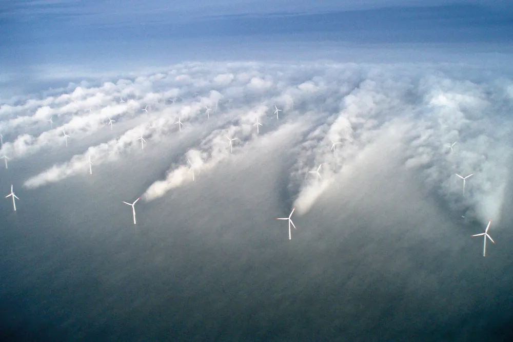 Low-hanging fog shows what is not usually possible to see with the naked eye, wind wakes trailing behind turbines at Vattenfall’s Horns Rev wind farm off Denmark.