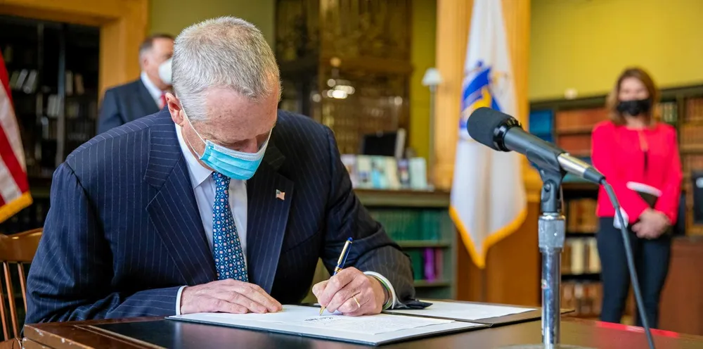 Charlie Baker signs the Bill.