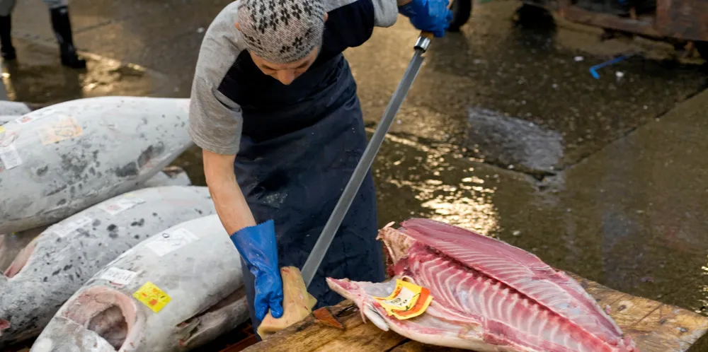 A vendor at the world's largest fish market in Toyosu, Japan.