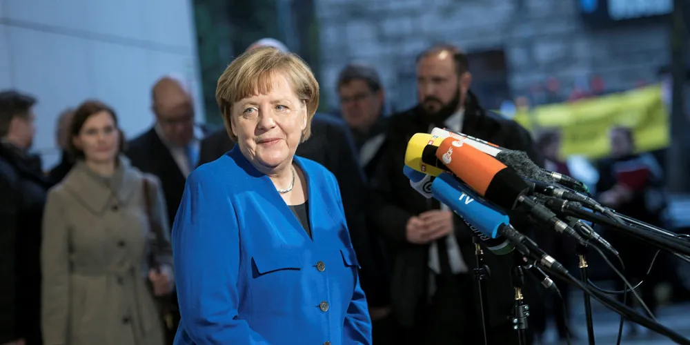 Angela Merkel arrives at the headquarters of the SPD for the conclusion of preliminary coalition talks.
