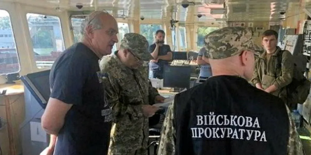 Officers of the Ukrainian security services surround a crew member of the Nika Spirit in 2019.