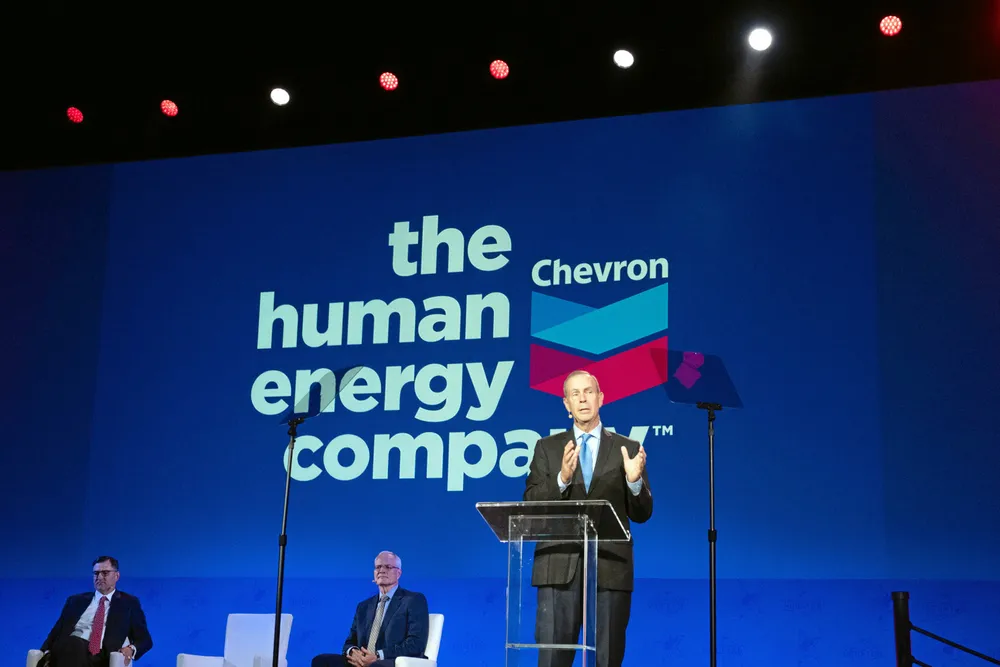 Workers' revolt: Mike Wirth, Chevron chief executive (standing).