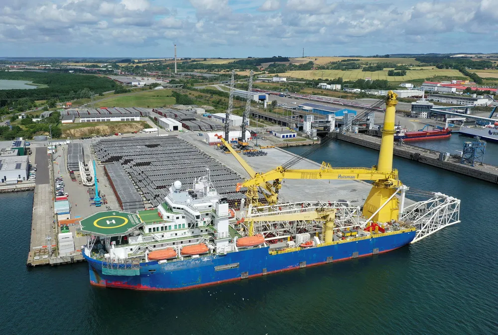 On standby: Russian pipelay vessel Akademik Chersky, with its name concealed, moored next to stockpile of coated pipes for Nord Stream 2 project in the port of Mukran in Germany