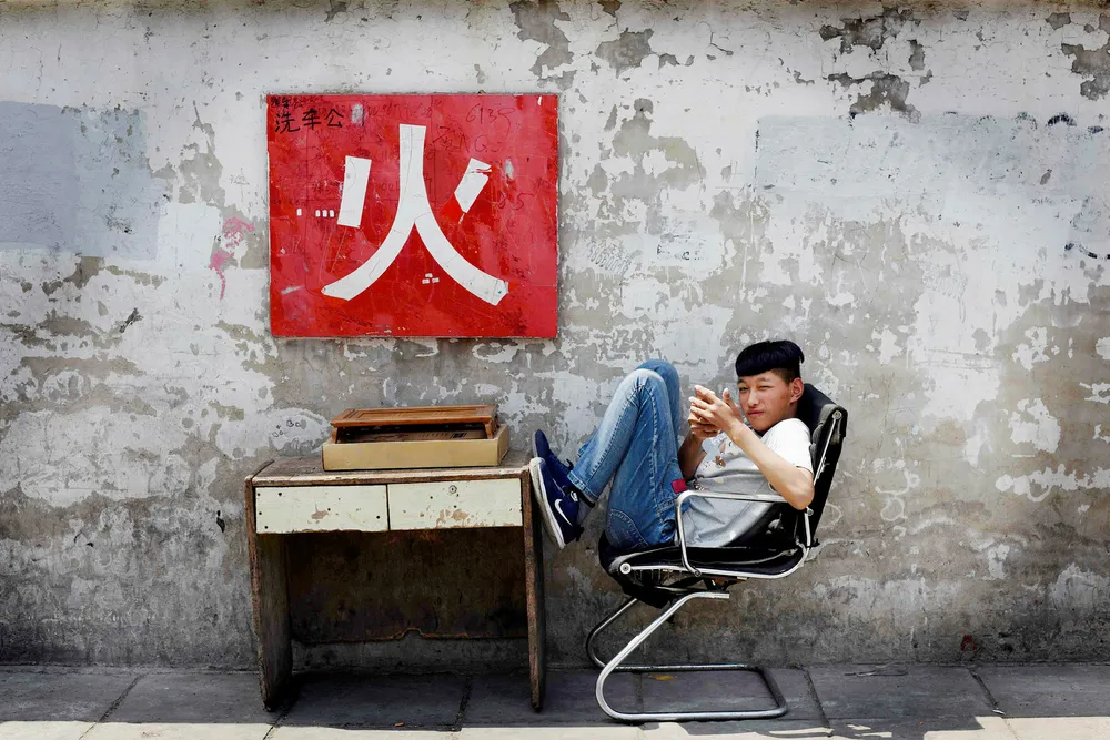 Gjelden i gråmarkedet i Kina fortsetter å vokse i urovekkende tempo til tross for dempende tiltak fra myndighetene Foto: Greg Baker/AFP/NTB Scanpix