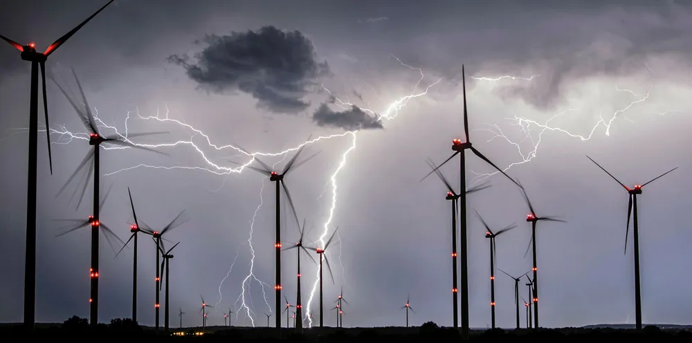 Lightning flashes over windmills of the Odervorland wind energy park near Sieversdorf, eastern Germany.
