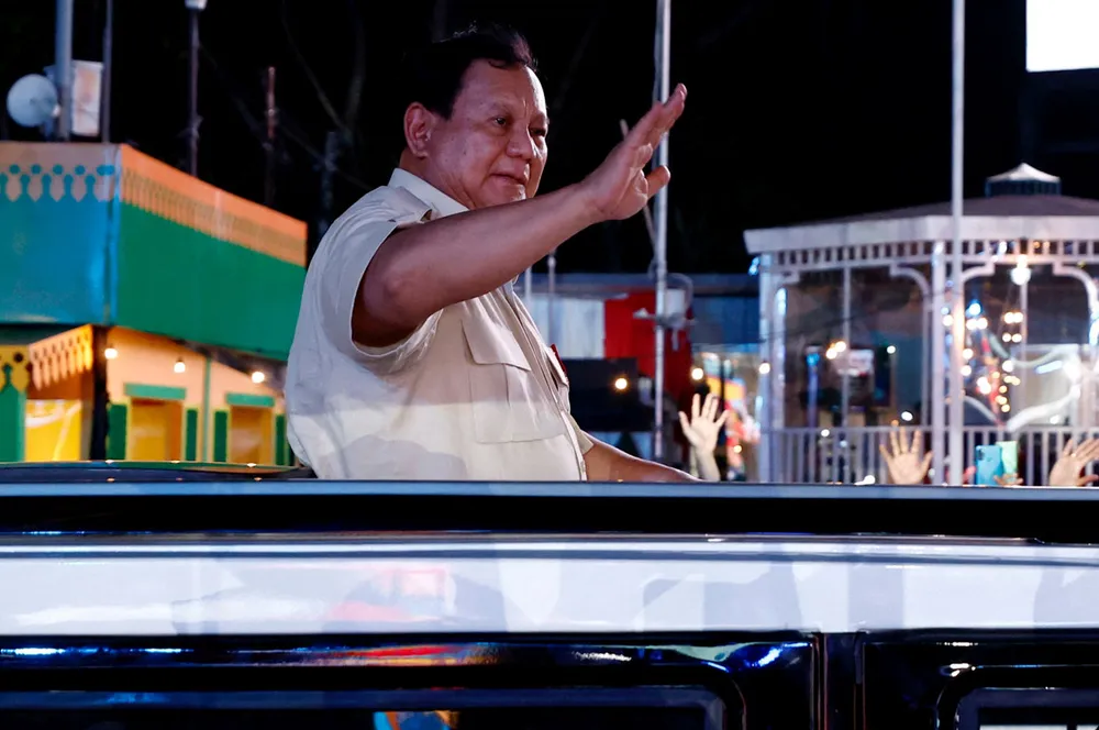 Indonesia's President Prabowo Subianto greets people on New Year's Eve in Jakarta, Indonesia.