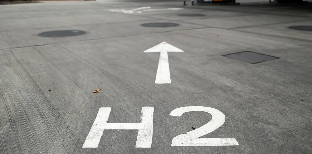 An H2 sign, painted on the forecourt, directs vehicles towards Royal Dutch Shell Plc's hydrogen refueling pumps at their first UK hydrogen refueling station fuel station.